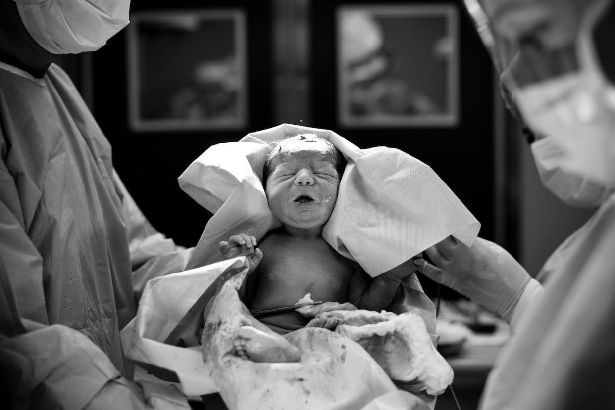 Enforcement of binary gender norms has led to unwanted medical interventions on intersex and cisgender children. <a href="https://www.gettyimages.com/detail/photo/doctors-carrying-newborn-baby-girl-at-hospital-royalty-free-image/668808357" rel="nofollow noopener" target="_blank" data-ylk="slk:Javier Valenzuela/EyeEm via Getty Images;elm:context_link;itc:0;sec:content-canvas" class="link ">Javier Valenzuela/EyeEm via Getty Images</a>