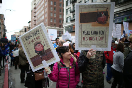 People participate in a protest march calling for human rights and dignity for immigrants, in Los Angeles, February 18, 2017. REUTERS/Lucy Nicholson