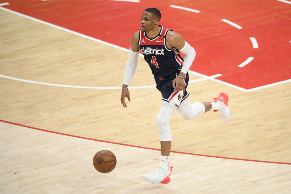 Washington Wizards guard Russell Westbrook (4) dribbles the ball during the first half of an NBA basketball game against the Cleveland Cavaliers, Friday, May 14, 2021, in Washington. (AP Photo/Nick Wass)