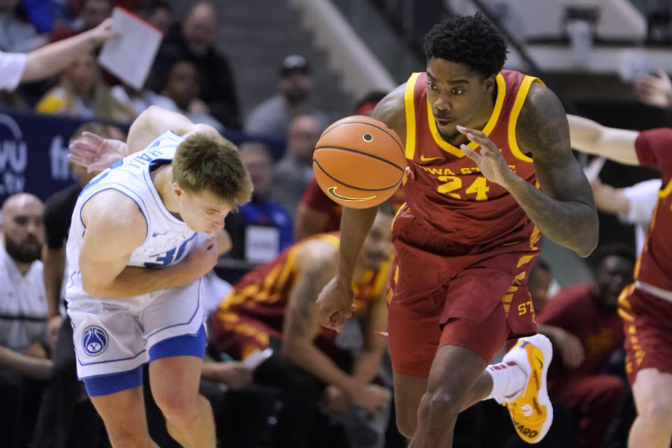 Iowa State forward Hason Ward (24), steals the ball from BYU guard Dallin Hall, left, during the first half of an NCAA college basketball game Tuesday, Jan. 16, 2024, in Provo, Utah. (AP Photo/George Frey)