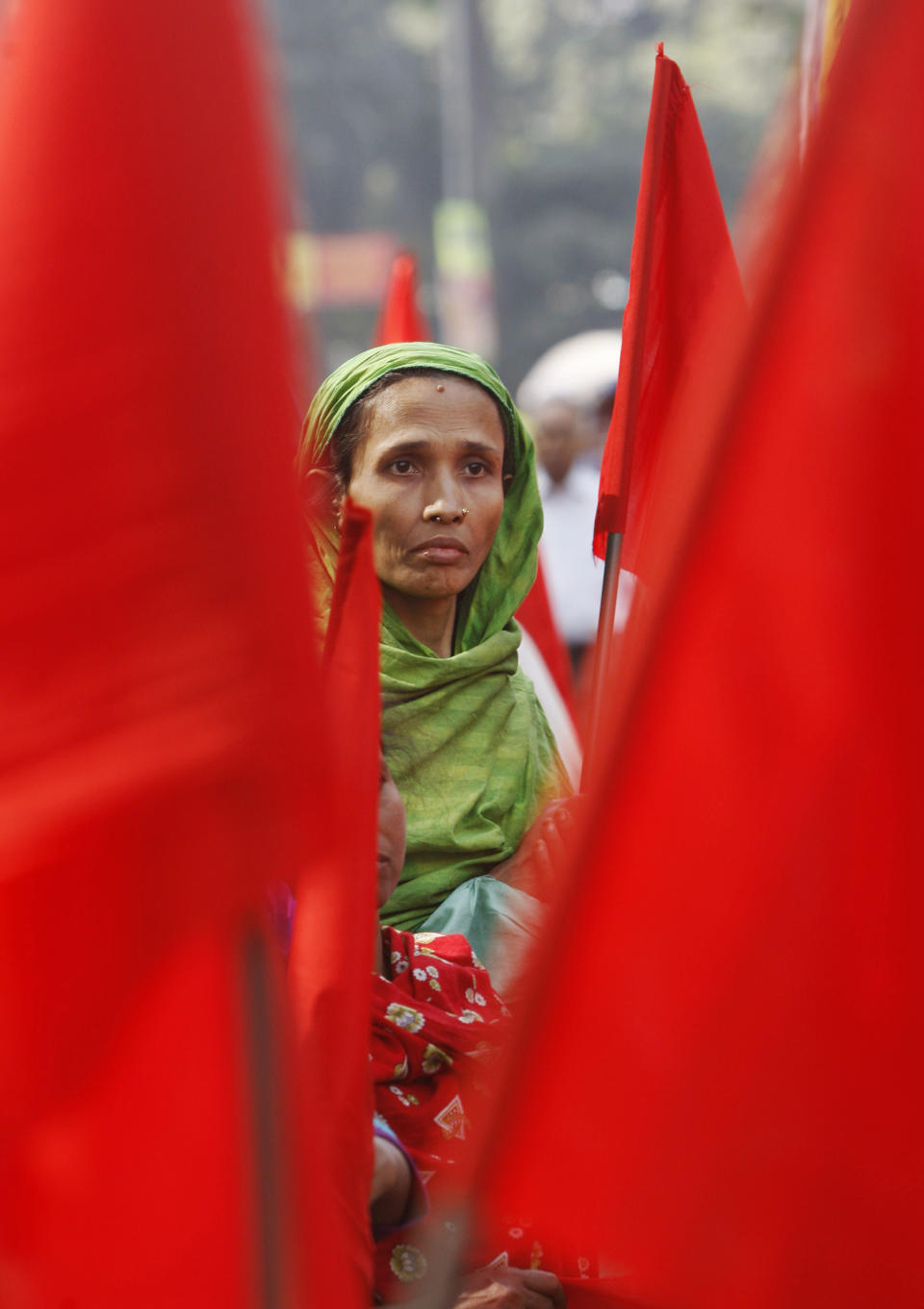 A Bangladeshi garment worker participates in a protest to mourn the death of the victims of a fire in a garment factory in Dhaka, Bangladesh, Friday, Nov. 30, 2012. Hundreds of garment workers protested Friday outside the Bangladeshi factory where 112 people were killed by the fire, demanding compensation for their lost salaries. (AP Photo/Pavel Rahman)