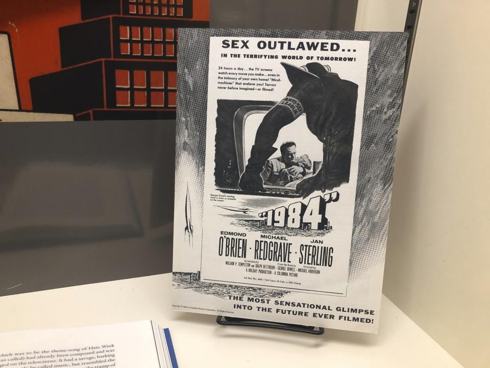 In this Oct. 23, 2019, photo, poster promoting the movie version George Orwell's 1949 novel "1984" is shown at an exhibit in Albuquerque, N.M. celebrating the author's legacy. The exhibit at the University of New Mexico is tackling the themes of the novelist's work from "1984" to "Animal Farm." "George Orwell: His Enduring Legacy," which runs to April 2020, features posters and material related to work challenging totalitarianism. (AP Photo/ Russell Contreras)