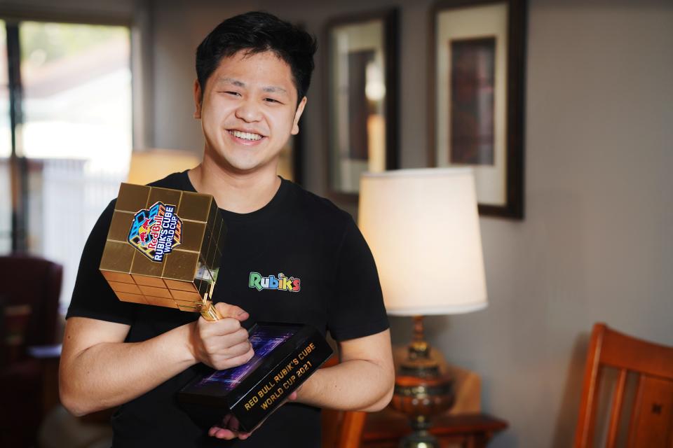 Max Park shows off one his cubing trophies