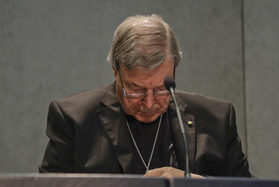 FILE - In this June 29, 2017, file photo, Cardinal George Pell meets the media at the Vatican. Pell was sentenced in an Australian court on Wednesday, March 13, 2019 to 6 years in prison for molesting two choirboys in a Melbourne cathedral more than 20 years ago. (AP Photo/Gregorio Borgia, File)