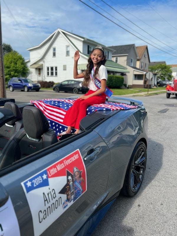 The winner of Little Miss Firecracker gets to do cool things like ride in the Ellwood City Memorial Parade as seen here with 2019 winner Aria Cannon.