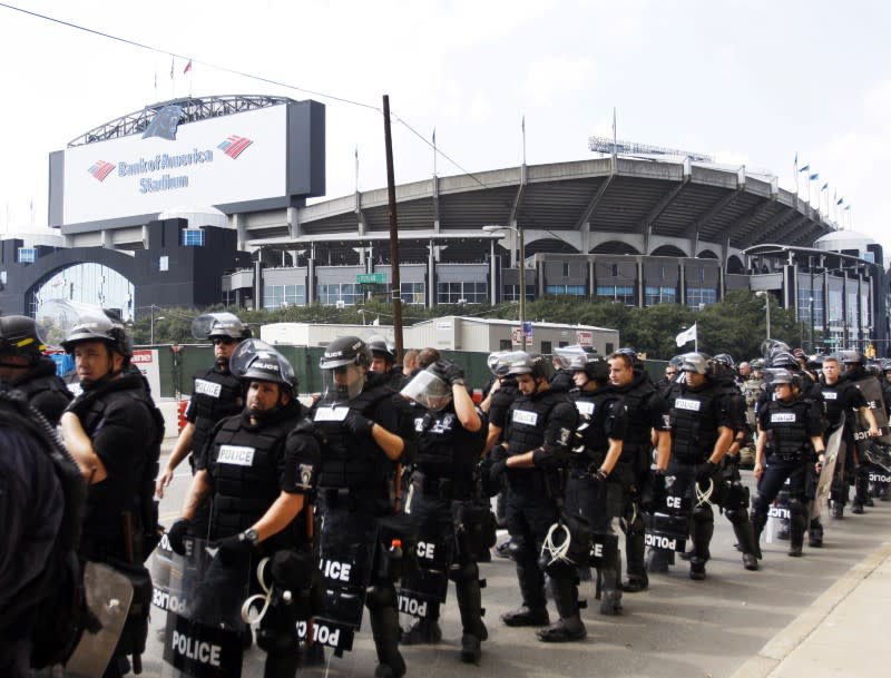 <p>Police line a street near Bank of American Stadium during the game between the Minnesota Vikings and the Carolina Panthers. Mandatory Credit: Angela Wilhelm/Citizen-Times via USA TODAY NETWORK </p>