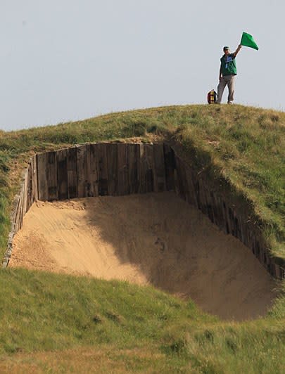 Where: Sandwich, Kent, England
Times hosting: 14 (last in 2011)
You know it as: "That place with the power plants towering in the horizon."
Unique feature: Fourth hole has the deepest bunker (left) in championship golf.
Noteworthy moments: RSG became the first course located outside of Scotland to host an Open in 1894. More than a century later, it was the site of one of the game's most surprising wins when Ben Curtis -- ranked 396th in the world -- claimed the claret jug.