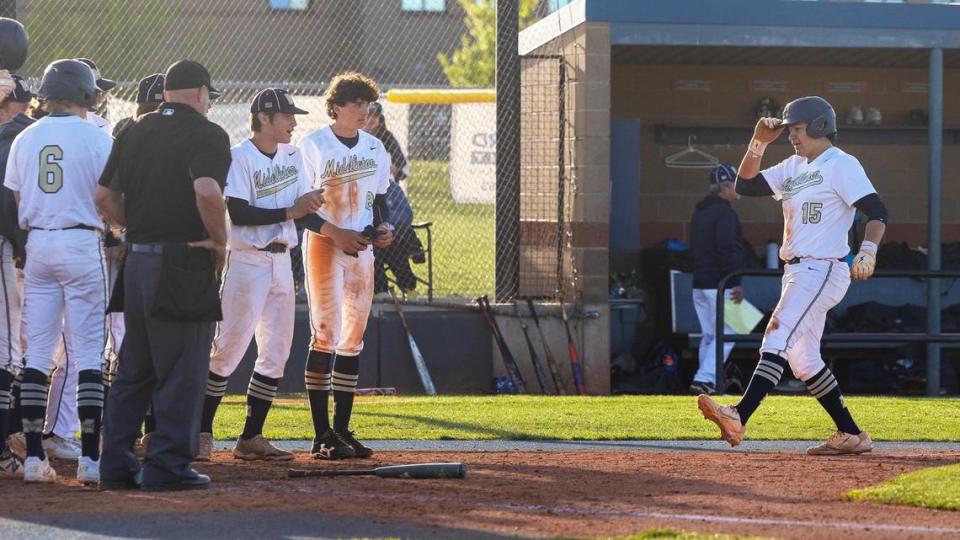 Middleton senior Josh Lucido, right, is greeted by his teammates after a solo home run in the fifth inning Tuesday.