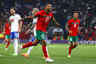 FILE - Morocco's Sofiane Boufal celebrates after scoring the opening goal during an international friendly soccer match between Morocco and Chile at the Cornella-El Prat stadium in Barcelona, Spain, Friday, Sept. 23, 2022. (AP Photo/Joan Monfort, File)