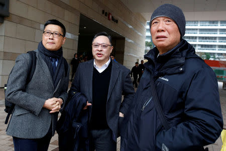FILE PHOTO: Occupy Central civil disobedience founders, (L-R) professor of sociology Chan Kin-man, law professor Benny Tai and Reverend Chu Yiu-ming, leave a court after a pre-trial hearing in Hong Kong, China January 9, 2018. REUTERS/Bobby Yip/File Photo