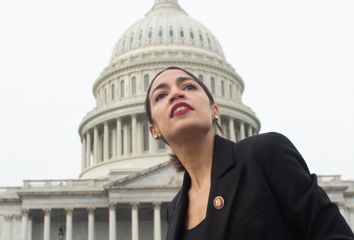 <p>US Representative Alexandria Ocasio-Cortez, Democrat of New York, leaves a photo opportunity with the female Democratic members of the 116th US House of Representatives outside the US Capitol in Washington, DC, January 4, 2019</p> (SAUL LOEB/AFP via Getty Images)