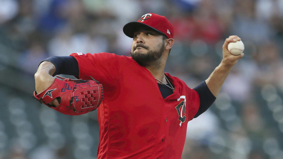 FIEL - In this Sept. 17, 2019, file photo, Minnesota Twins pitcher Martin Pérez throws against the Chicago White Sox in the first inning of a baseball game in Minneapolis. People familiar with the negotiations tell The Associated Press on Friday, Dec. 13, 2019, that the Boston Red Sox have agreed to one-year contracts with free agent left-hander Martin Pérez and shortstop José Peraza. The people spoke on the condition of anonymity because the deals had not yet been announced. (AP Photo/Jim Mone, File)