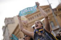 A protester shouts slogans during a demonstration in Barcelona on October 21, 2017