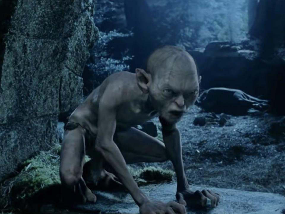 Gollum crouching down in lord of the rings