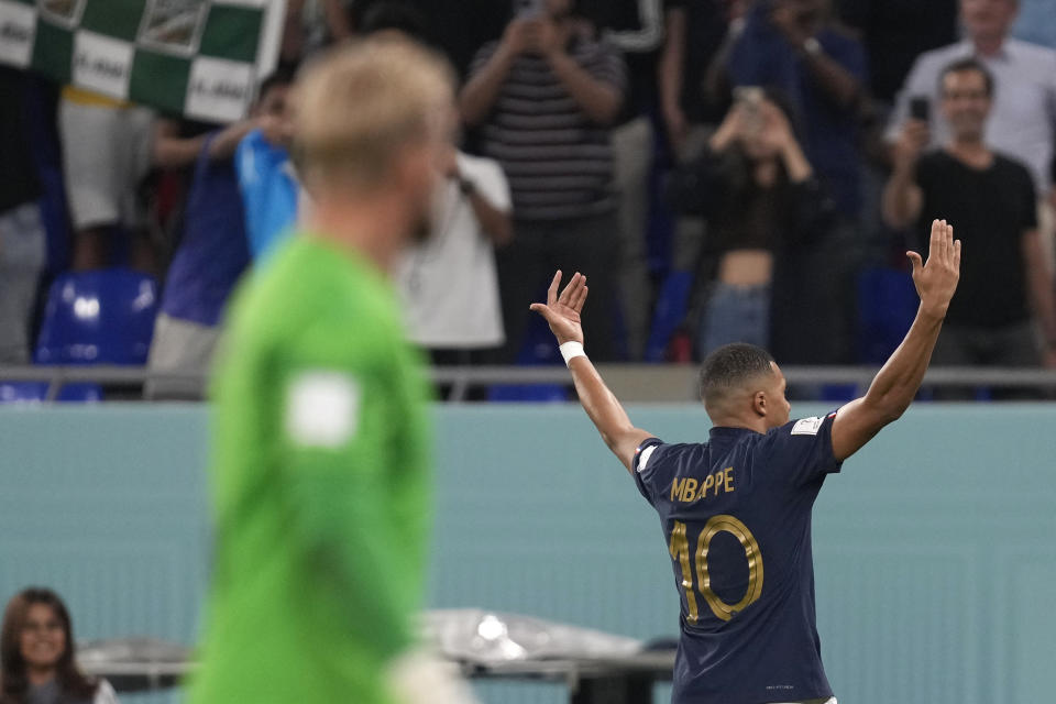 France's Kylian Mbappe celebrates after scoring his sides first goal during the World Cup group D soccer match between France and Denmark, at the Stadium 974 in Doha, Qatar, Saturday, Nov. 26, 2022. (AP Photo/Thanassis Stavrakis)