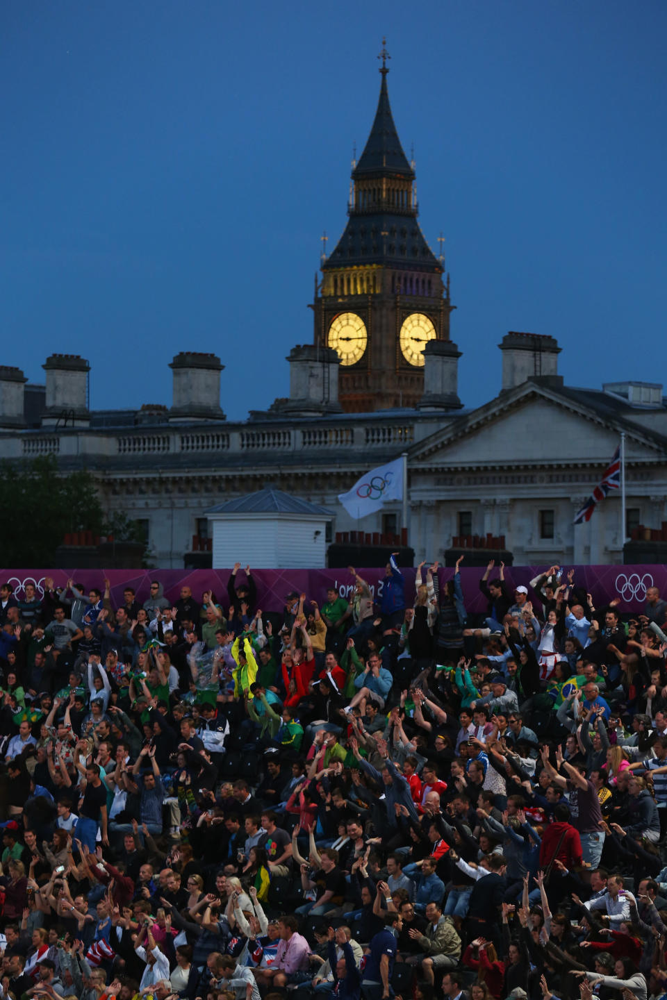 LONDON, ENGLAND - JULY 28: Fans enjoy the atmosphere during the Women's Beach Volleyball Preliminary Round between Switzerland and Greece on Day 1 of the London 2012 Olympic Games at Horse Guards Parade on July 28, 2012 in London, England. (Photo by Ryan Pierse/Getty Images)