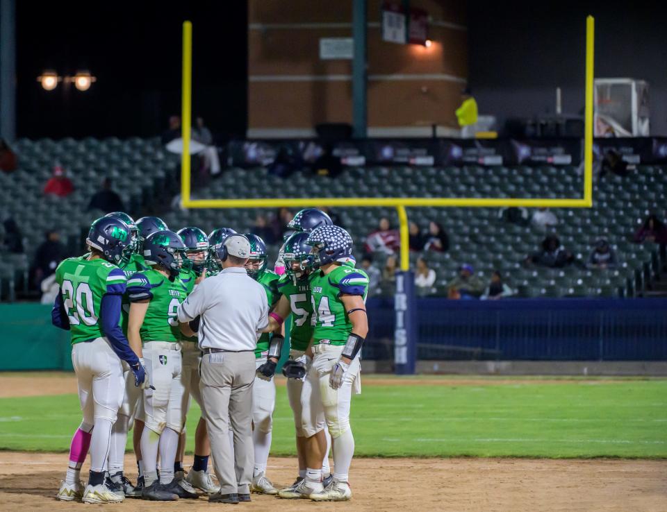 Peoria Notre Dame head coach Pat Armstrong talks with his team before they take the field against Peoria High in a Week 9 football game Friday, Oct. 20, 2023 at Dozer Park in Peoria.