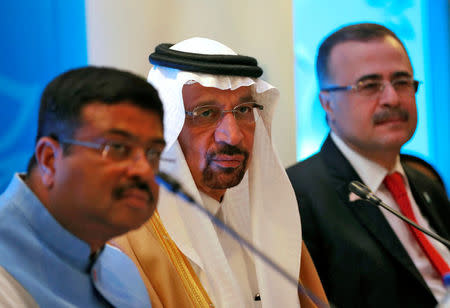 Saudi Energy Minister Khalid al-Falih addresses the media flanked by India's FILE PHOTO: Oil Minister Dharmendra Pradhan (L) and Saudi Aramco Chief Executive Officer Amin Nasser (R) during International Energy Forum (IEF) to announce Saudi Aramco's participation in the planned refinery project in western state of Maharashtra, in New Delhi, India, April 11, 2018. REUTERS/Altaf Hussain