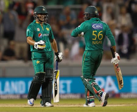 Britain Cricket - England v Pakistan - NatWest International T20 - Emirates Old Trafford - 7/9/16 Pakistan's Khalid Latif and Babar Azam celebrate after the match Action Images via Reuters / Lee Smith Livepic
