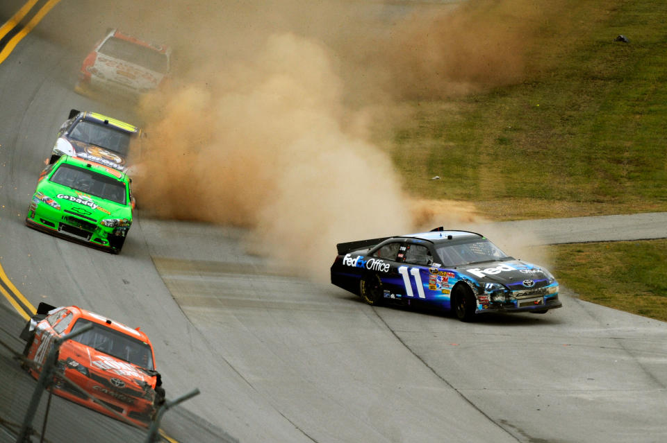 TALLADEGA, AL - OCTOBER 23: Denny Hamlin, driver of the #11 FedEx Office Toyota, loses control of his car during the NASCAR Sprint Cup Series Good Sam Club 500 at Talladega Superspeedway on October 23, 2011 in Talladega, Alabama. (Photo by Jared C. Tilton/Getty Images for NASCAR)
