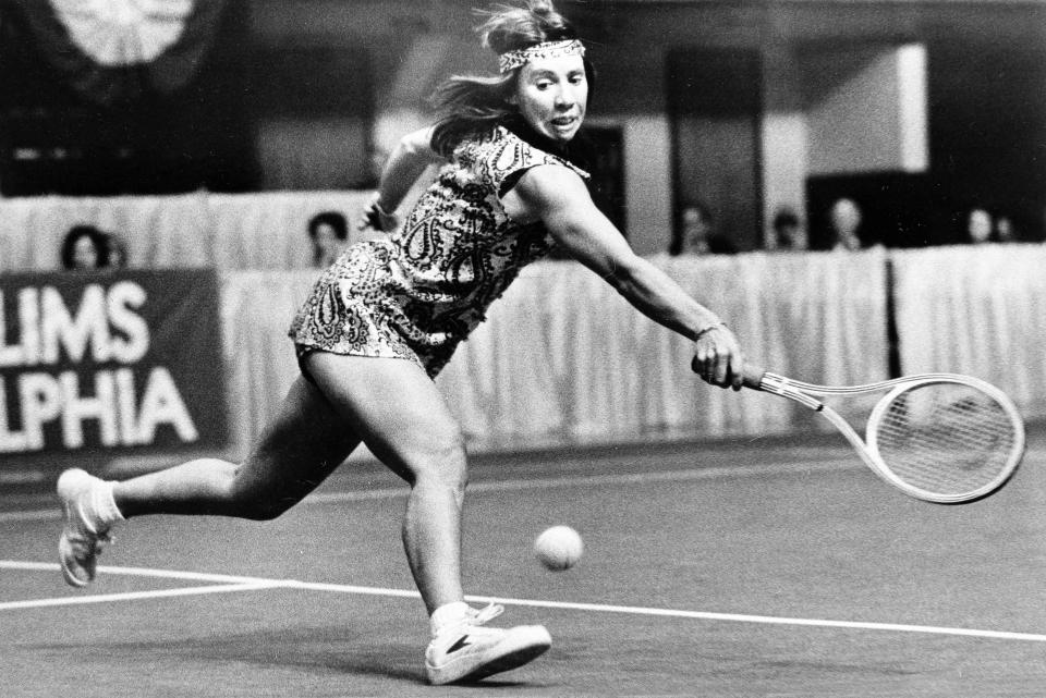 FILE - In this March 17, 1977, file photo, Rosie Casals of Sausalito, Calif., catches up with the ball for a backhand return during her match with Mary Hamm at the Virginia Slims tournament in Philadelphia. Casals won, 6-2, 6-4. It’s the 50th anniversary of Billie Jean King and eight other women breaking away from the tennis establishment in 1970 and signing a $1 contract to form the Virginia Slims circuit. That led to the WTA Tour, which offers millions in prize money. Casals was one of then nine. (AP Photo/Rusty Kennedy, File)