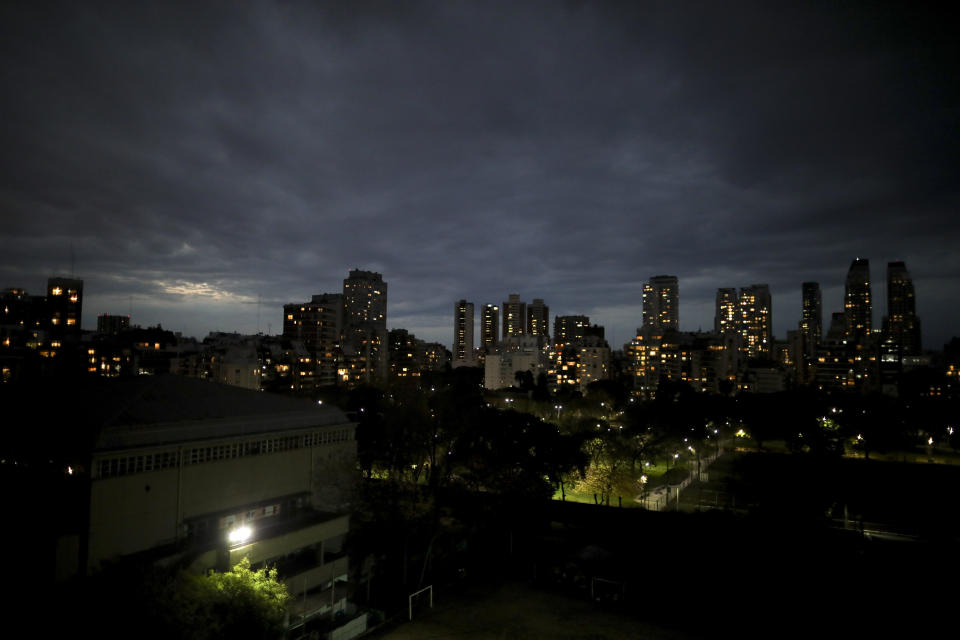 The sun sets in Buenos Aires, Argentina, June 22, 2020, a country with one of the longest government-ordered lockdowns to curb the spread of the new coronavirus. However, in contrast to the damaging effects of confinement on the economy and mental health, many Argentines consider quarantine an ideal state, or have been able to give a positive meaning to confinement. (AP Photo/Natacha Pisarenko)