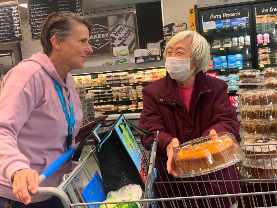 Marie Lum, a ACC Senior Services participant, shops with volunteer Julie Zumalt on Dec. 19 at WalMart in the Delta Shores shopping center. ACC Senior Services has expanded its Senior Escort program to include group shopping trips to help seniors run errands.