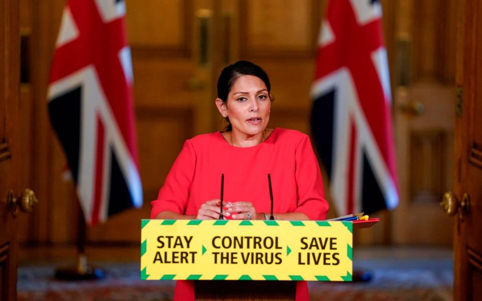 A handout image released by 10 Downing Street, shows Britain's Home Secretary Priti Patel attending a remote press conference to update the nation on the novel coronavirus COVID-19 pandemic, inside 10 Downing Street in central London on May 22, 2020. - Andrew Parsons/AFP