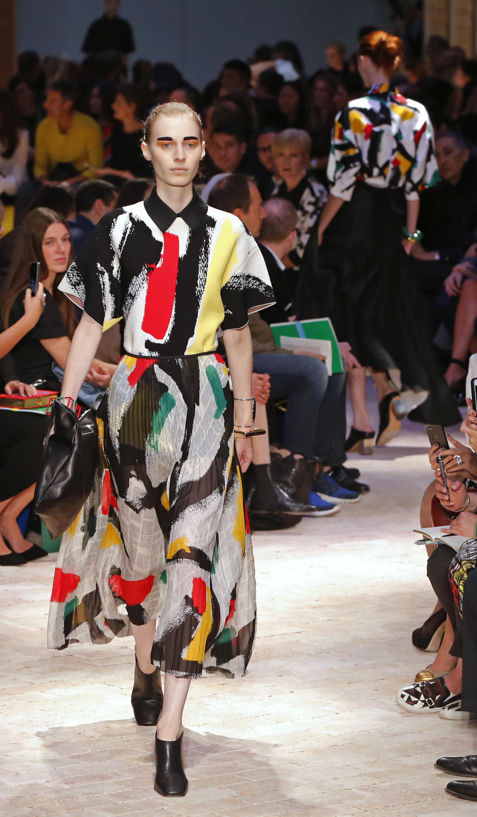 A model presents a creation as part of Celine's ready-to-wear Spring/Summer 2014 fashion collection, presented Sunday, Sept. 29, 2013 in Paris. (AP Photo/Jacques Brinon)