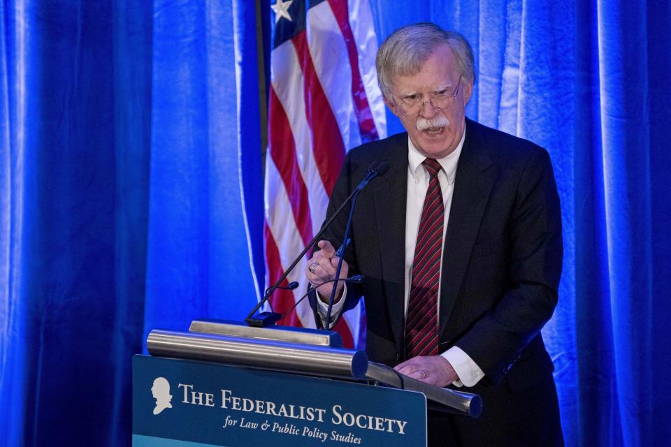 FILE - In this Monday, Sept. 10, 2018 file photo, National Security Adviser John Bolton speaks at a Federalist Society luncheon at the Mayflower Hotel, in Washington. Afghan rights workers are warning that Bolton's blistering attack on the International Criminal Court investigating war crimes allegations will strengthen a climate of impunity in Afghanistan, prolong the war and embolden those carrying out acts of violence. In a speech Monday, Bolton said Washington would not cooperate with The Hague-based court and threatened it with sanctions, saying it put U.S. sovereignty and national security at risk. (AP Photo/Andrew Harnik, File)