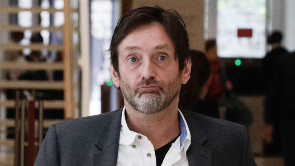 This photograph taken on June 6, 2019, shows French actor Pierre Palmade leaving the Paris Courthouse. - Already under investigation for the serious road accident he caused on February 10, 2023 under the influence of cocaine, French actor Pierre Palmade is now also targeted by an investigation for possession of images of child pornography, following a tip off from an unidentified man, Police said on February 19. (Photo by Geoffroy VAN DER HASSELT / AFP)