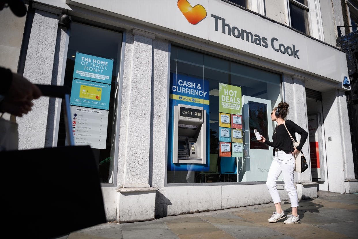 LONDON, ENGLAND - SEPTEMBER 20: Shoppers walk past a branch of travel agent chain Thomas Cook on September 20, 2019 in London, England. Banks are insisting that the company finds £200m more in extra contingency funds, or it faces the prospect of falling into administration. If the company does collapse, around 150,000 holiday-makers would need to be repatriated from their current locations. (Photo by Leon Neal/Getty Images)