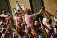 <p>Revelers party at the launch of the c<em>hupinazo</em> rocket to celebrate the official opening of the 2017 San Fermín Fiesta. (Photo: Alvaro Barrientos/AP) </p>