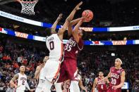 Mar 21, 2019; Salt Lake City, UT, USA; New Mexico State Aggies forward Robert Brown (25) shoots as Auburn Tigers forward Horace Spencer (0) defends during the second half in the first round of the 2019 NCAA Tournament at Vivint Smart Home Arena. Mandatory Credit: Kirby Lee-USA TODAY Sports