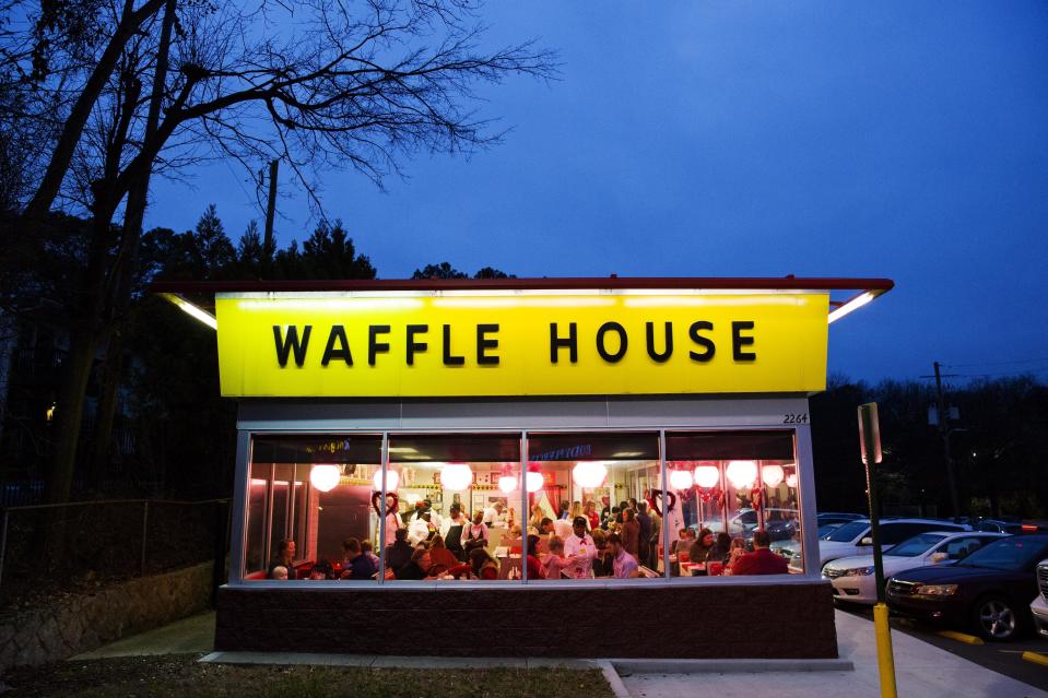 Diners eat at a Waffle House restaurant decorated for Valentine’s Day in Atlanta, Wednesday, Feb. 14, 2018. (AP Photo/David Goldman)