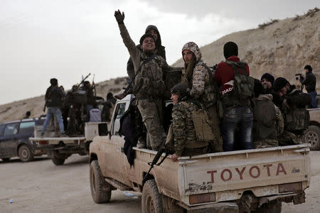 Turkish-backed Free Syrian Army fighters are seen near Mount Barsaya, northeast of Afrin, Syria January 22,2018. REUTERS/Khalil Ashawi