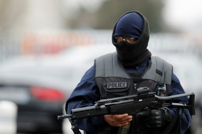 A French policeman secures the area at Paris' Orly airport after security forces fatally shot a man who tried to grab a soldier's firearm, on March 18, 2017