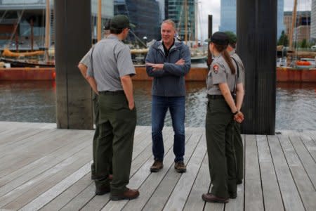 U.S. Interior Secretary Ryan Zinke (C) talks to National Park Service Rangers, while traveling for his National Monuments Review process, in Boston, Massachusetts, U.S., June 16, 2017. REUTERS/Brian Snyder