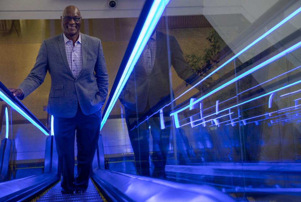 Luther Bradley, a former first-round draft pick for the Detroit Lions and Blue Cross Blue Shield of Michigan (BCBSM) consultant, smiles as he rides an escalator inside the BCBSM headquarters in Detroit on Tuesday, April 25, 2023. Bradley was an All-American defensive back at Notre Dame, where he played in two national championships and was selected 11th overall in the 1978 NFL draft.
