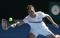 Tennis - Australian Open - Rod Laver Arena, Melbourne, Australia, January 22, 2018. Roger Federer of Switzerland hits a shot against Marton Fucsovics of Hungary. REUTERS/Thomas Peter