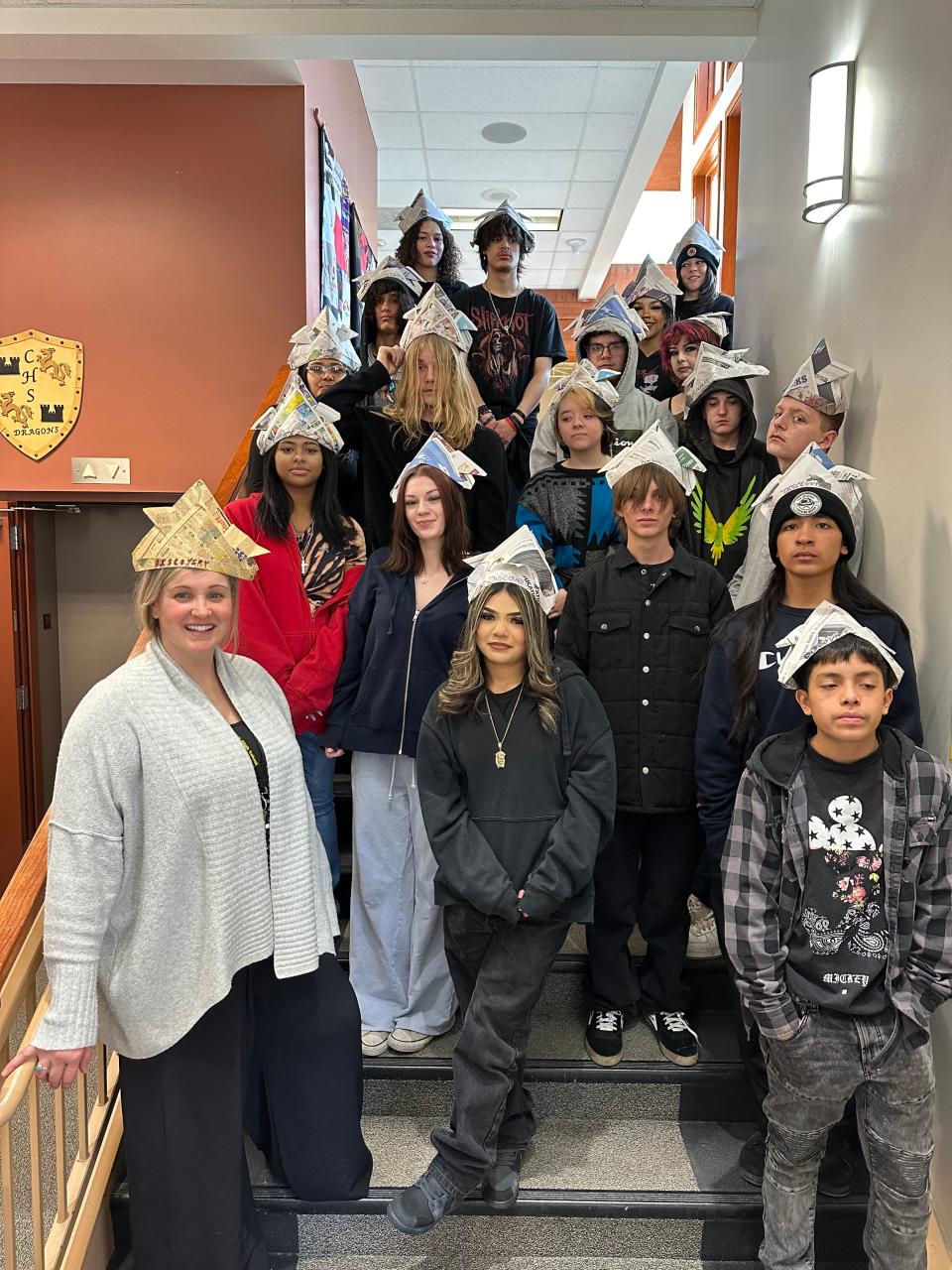 Teacher and dean Galynn Lackey, lower left, stands with new students who are being introduced to the school in the traditional Warrior Walk after the first week of the Discovery class on Feb. 23 at Centennial High School in Fort Collins.