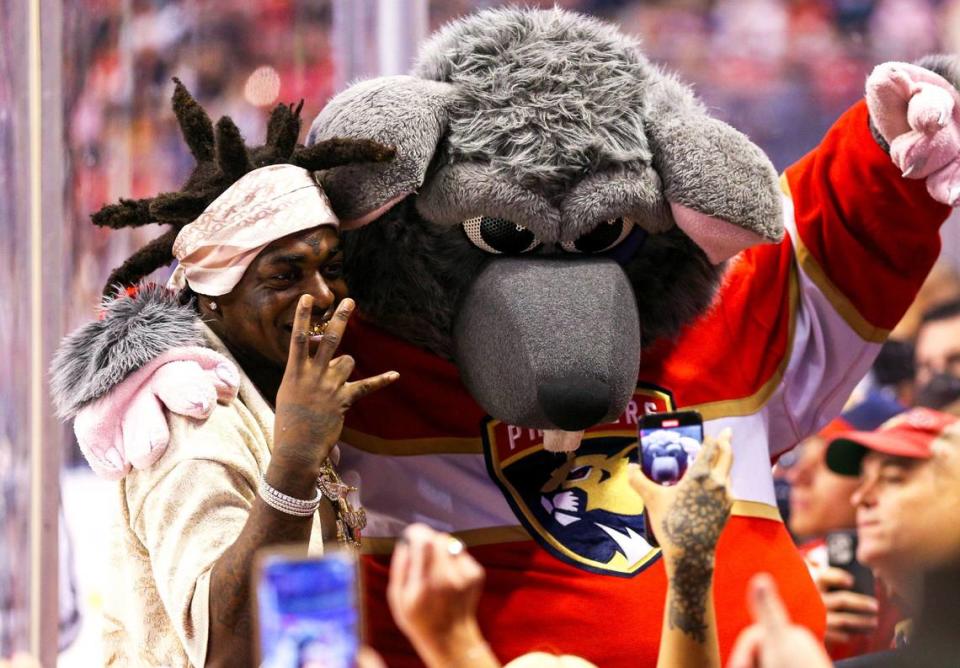 Rapper Kodak Black poses with Florida Panthers mascot Viktor E. Rat during the second period of an NHL game against the Vancouver Canucks at FLA Live Arena in Sunrise, Florida, on Tuesday, January 11, 2022.