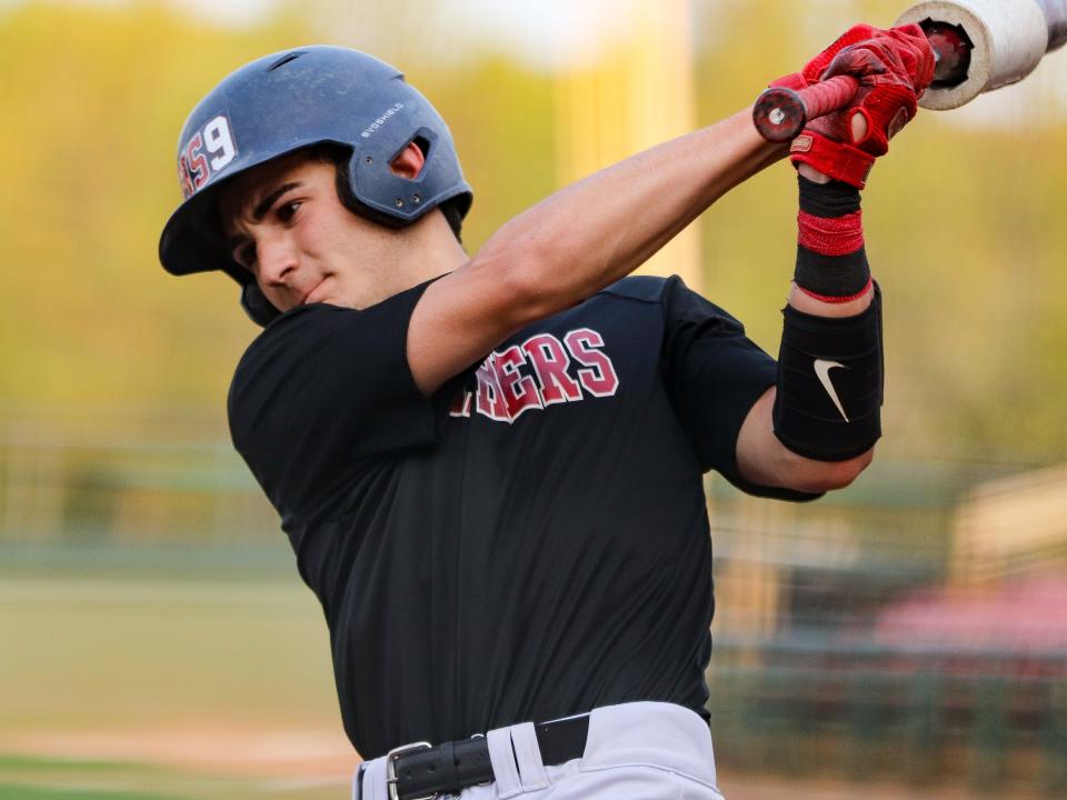 Whitman-Hanson's Cam Beltramini takes a practice swing during a game against Brockton at Campanelli Stadium on Monday, May 8, 2023.