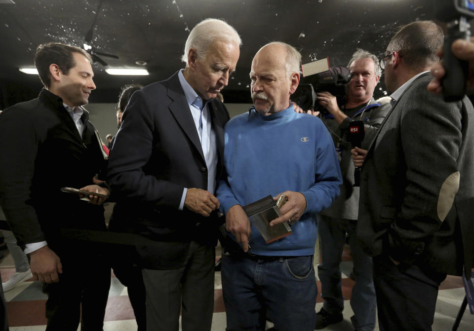 Democratic presidential candidate and former Vice President Joe Biden greets attendees during his "No Malarkey" bus tour at Johnson's Reception Hall in Elkader, Iowa, on Friday, Dec. 6, 2019. (Jessica Reilly/Telegraph Herald via AP)