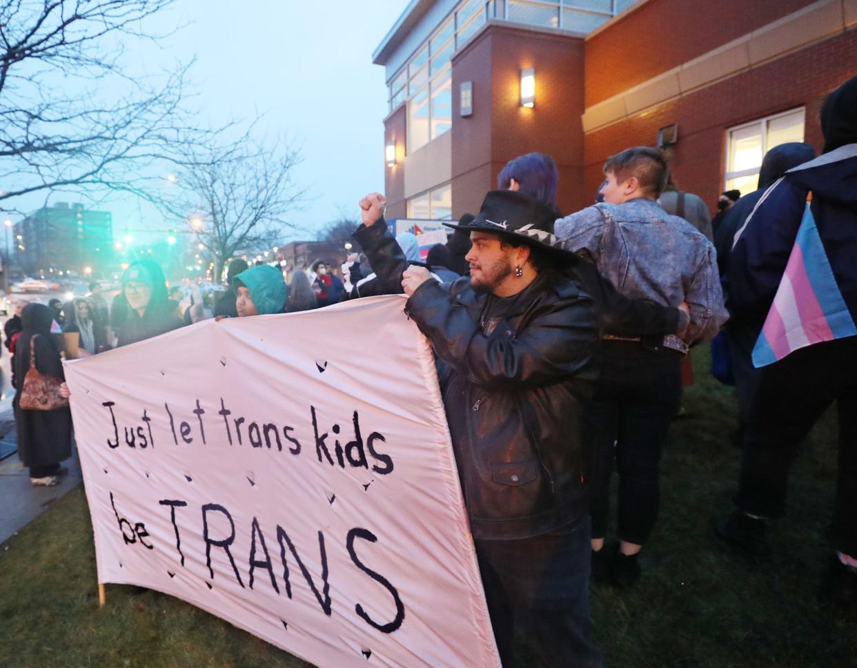 Kevyn Breedon, 32, reacts to a honk of support during a rally for trans rights at the Highland Square Branch Library on West Market Street in Akron on Wednesday. The Ohio Senate voted to override the governor's veto of House Bill 68, which will restrict gender-affirming care for minors.