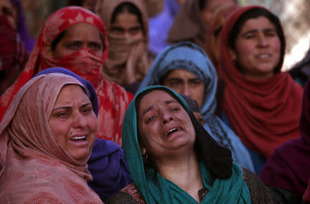 Women mourn during the funeral of Murtaza Bashir, a civilian, who according to local media reports was killed during clashes with Indian security forces near the site of a gun battle between suspected militants and Indian soldiers, during his funeral in Prichoo village in south Kashmir's Pulwama district, December 15, 2018. REUTERS/Danish Ismail