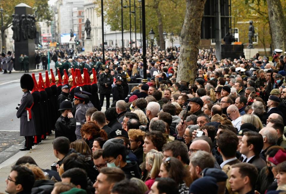 Crowds gathered ahead of the service at the Cenotaph (Toby Melville/PA) (PA Wire)