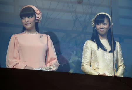 FILE PHOTO: Japan's Princess Mako (L) and Princess Kako, daughters of Prince Akishino and his wife Princess Kiko appear before well-wishers as they celebrate Emperor Akihito's 83rd birthday at the Imperial Palace in Tokyo, Japan, December 23, 2016. REUTERS/Issei Kato/File Photo