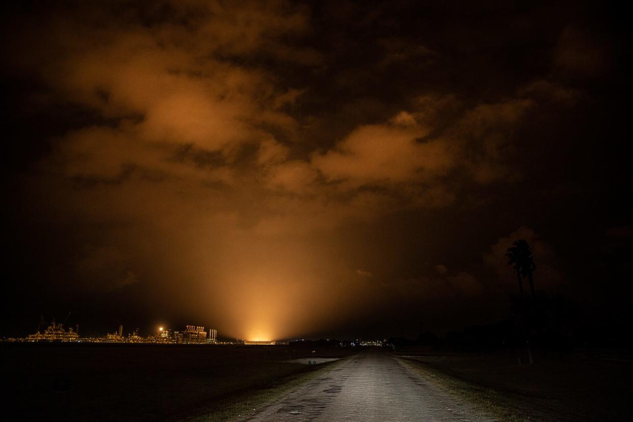 Ground flares at Gulf Coast Growth Ventures, an ethylene cracker plant, light up the sky around 9 p.m. on May 2, 2022, in San Patricio County, Texas.