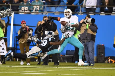 Nov 13, 2017; Charlotte, NC, USA; Carolina Panthers strong safety Mike Adams (29) breaks up a pass intended for Miami Dolphins tight end Julius Thomas (89) in the second quarter at Bank of America Stadium. Bob Donnan-USA TODAY Sports
